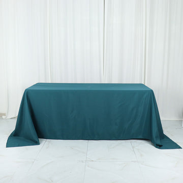 Add Elegance to Your Event with the Peacock Teal Seamless Polyester Rectangular Tablecloth 90"x132"