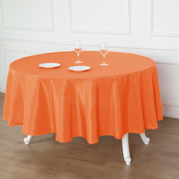 Create a Stunning Table Setting with the Orange Seamless Polyester Round Tablecloth 90"