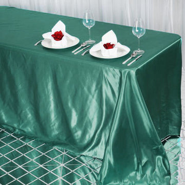 Enhance Your Wedding Decor with the Hunter Emerald Green Satin Seamless Rectangular Tablecloth 90"x132"