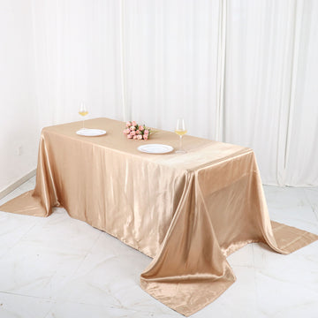 Experience Luxury with the Nude Satin Seamless Rectangular Tablecloth 90"x132"
