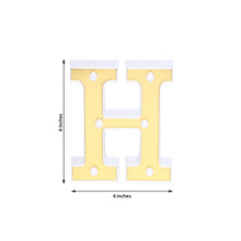 Indoor lighting for letters & table numbers: a yellow plastic marquee letter h that is 6 inches tall