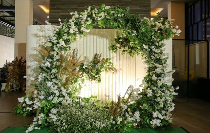 Photo booth zone with greenery and flowers