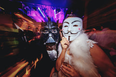 People wearing mask costumes in a party