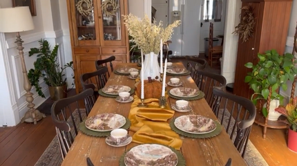Harvest table setup for a Thanksgiving dinner party