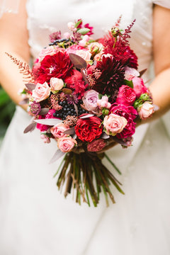 Colorful wedding flowers held in hand