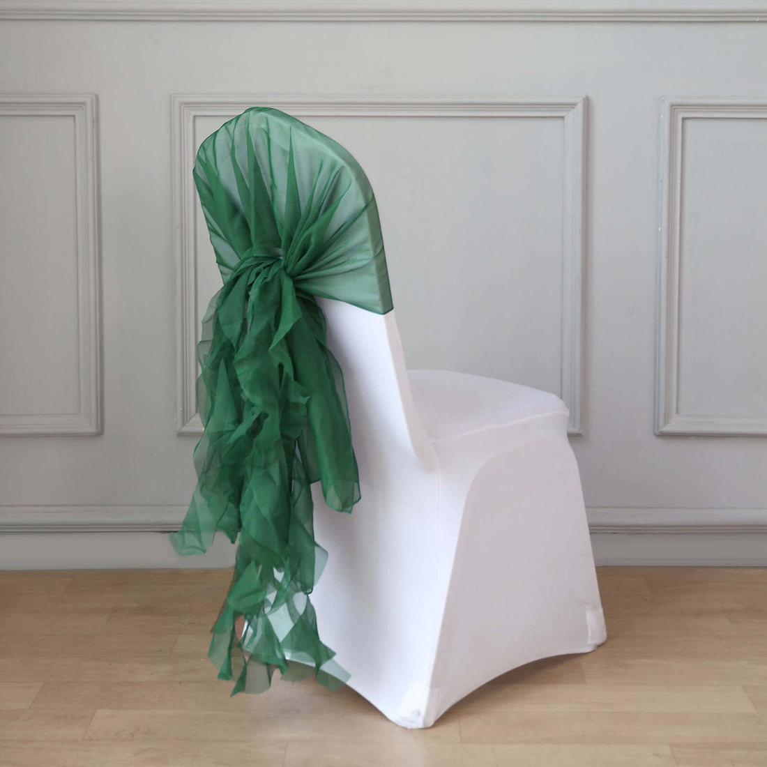 Green chair sash draped elegantly over a white chair.