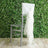 Silver chiavari chair with white draped fabric against a greenery backdrop.