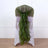 Green sheer chair sash draped elegantly on a white chair.