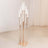 Elegant rose gold floor lamp with glass shades, perfect for modern decor.