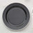 Black decorative plate with pearl-like trim