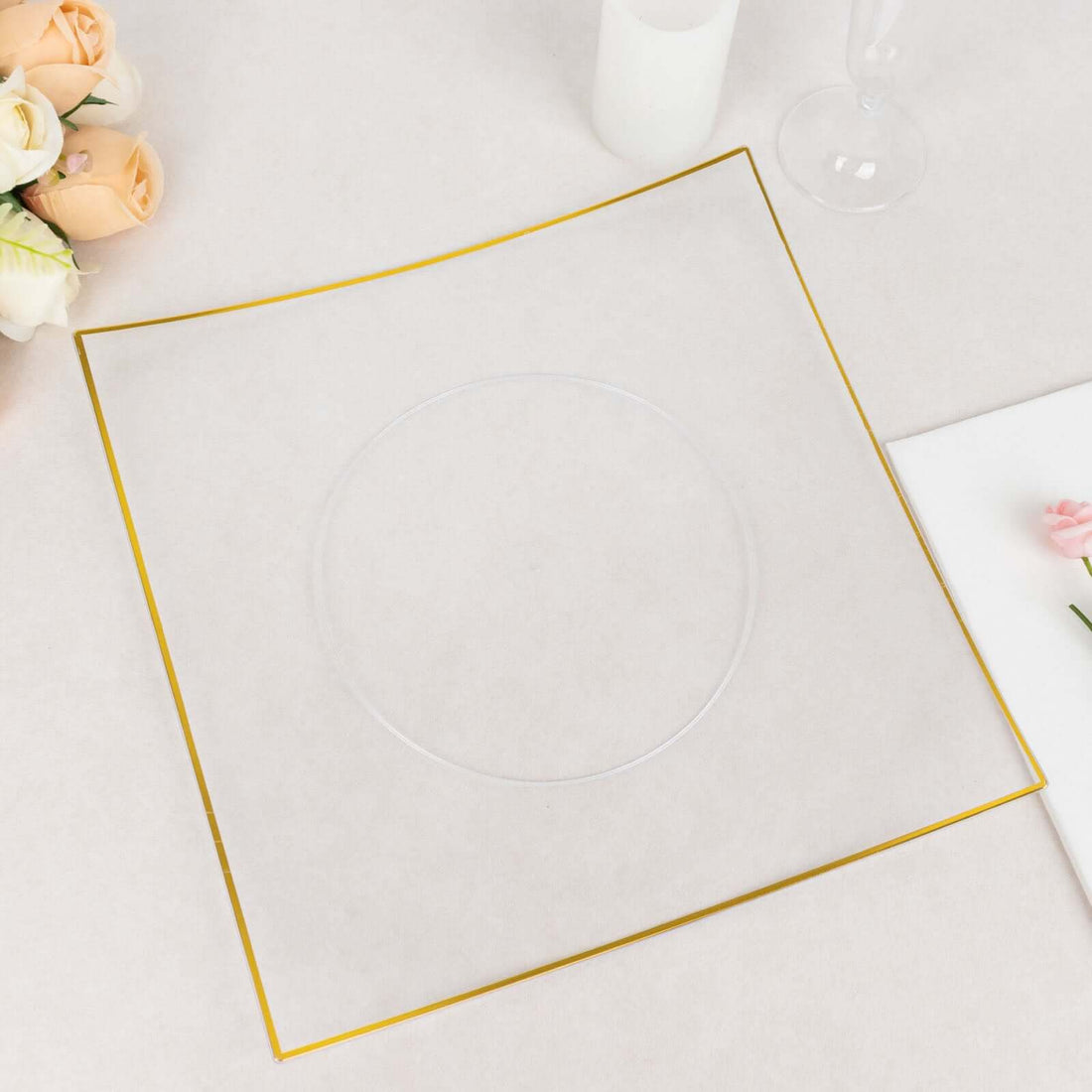 Clear acrylic plate with gold trim on a light background.