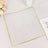 Clear acrylic plate with gold trim on a light background.
