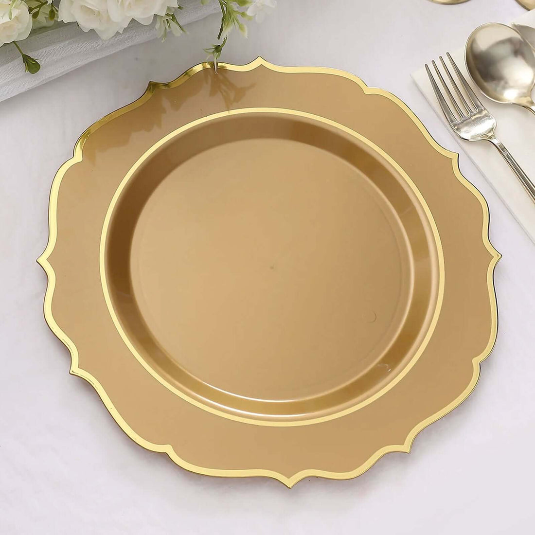 Gold scalloped charger plate on a plain white background.