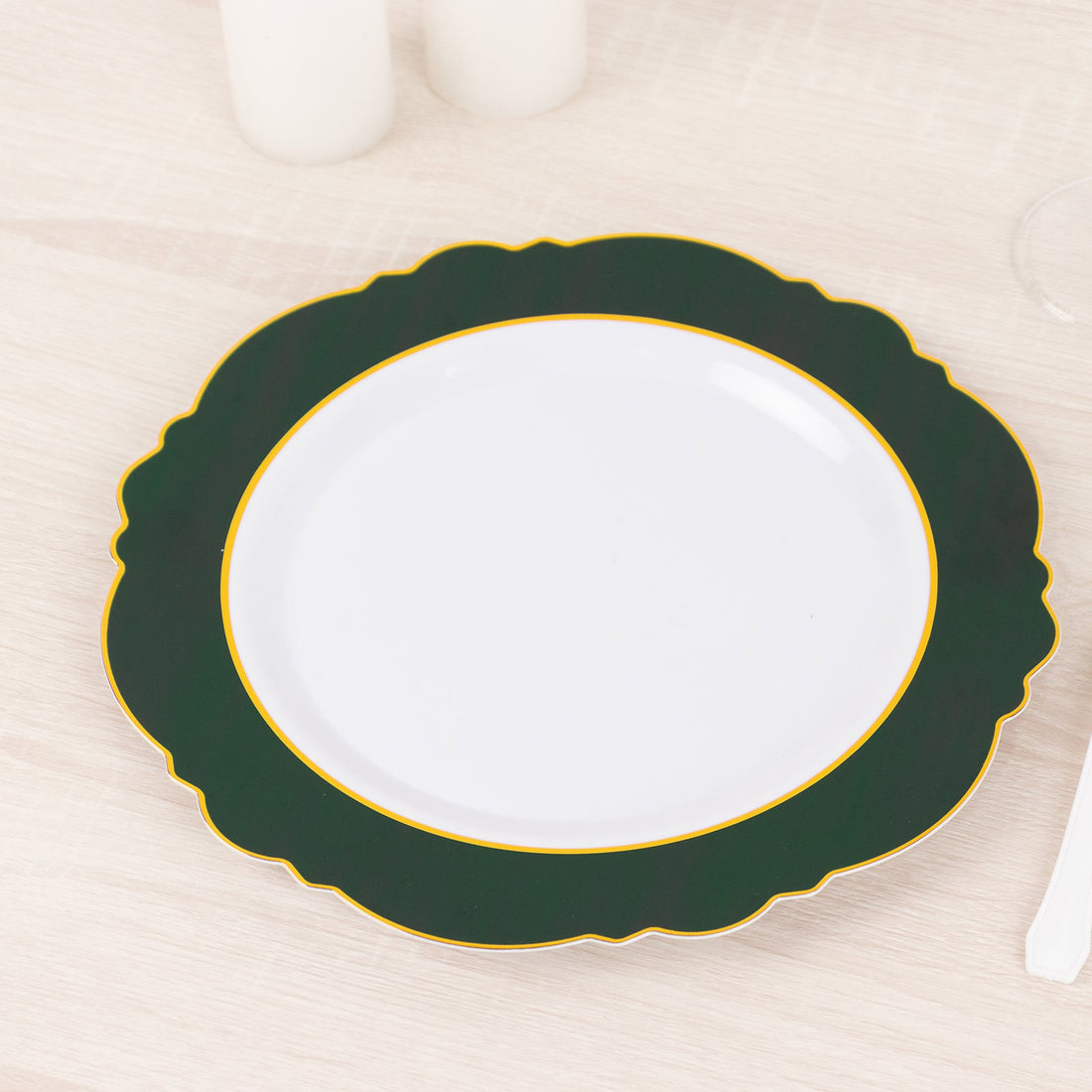 Green and white decorative plate with gold trim