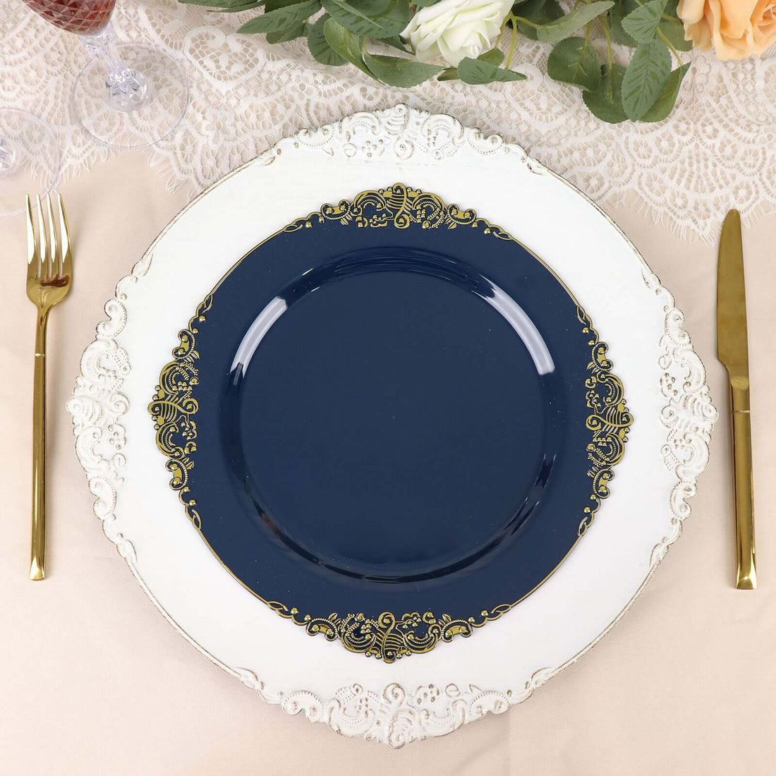 Elegant navy blue plate with gold accents on a decorative white charger.