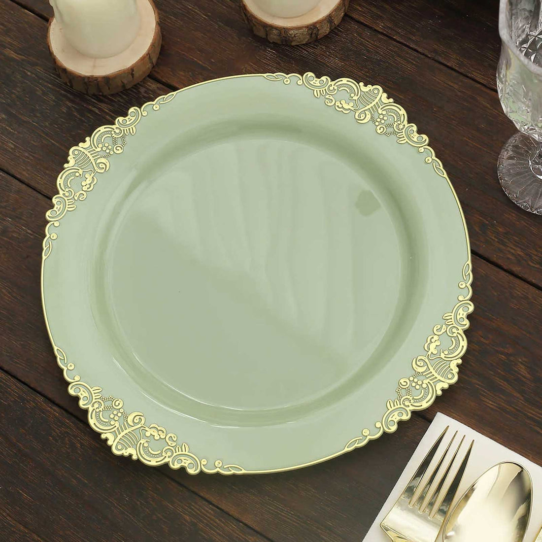 Elegant green plate with gold rim detailing on wooden table.