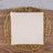 Square ceramic plate on a decorative gold wire charger.
