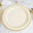 Elegant cream plate with gold trim on a textured white tablecloth.