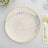 Elegant gold-patterned dinner plate on a white background.