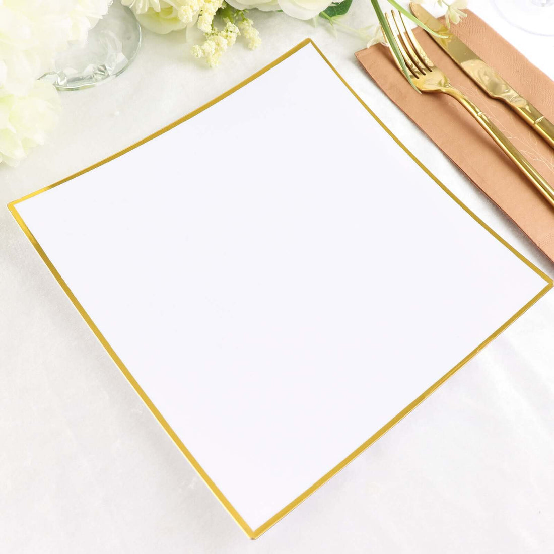 Elegant white plate with a gold rim on a soft background.