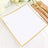 Elegant white plate with a gold rim on a soft background.