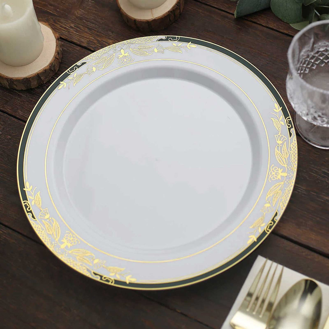 Elegant round plate with gold floral design on a rustic wooden table.