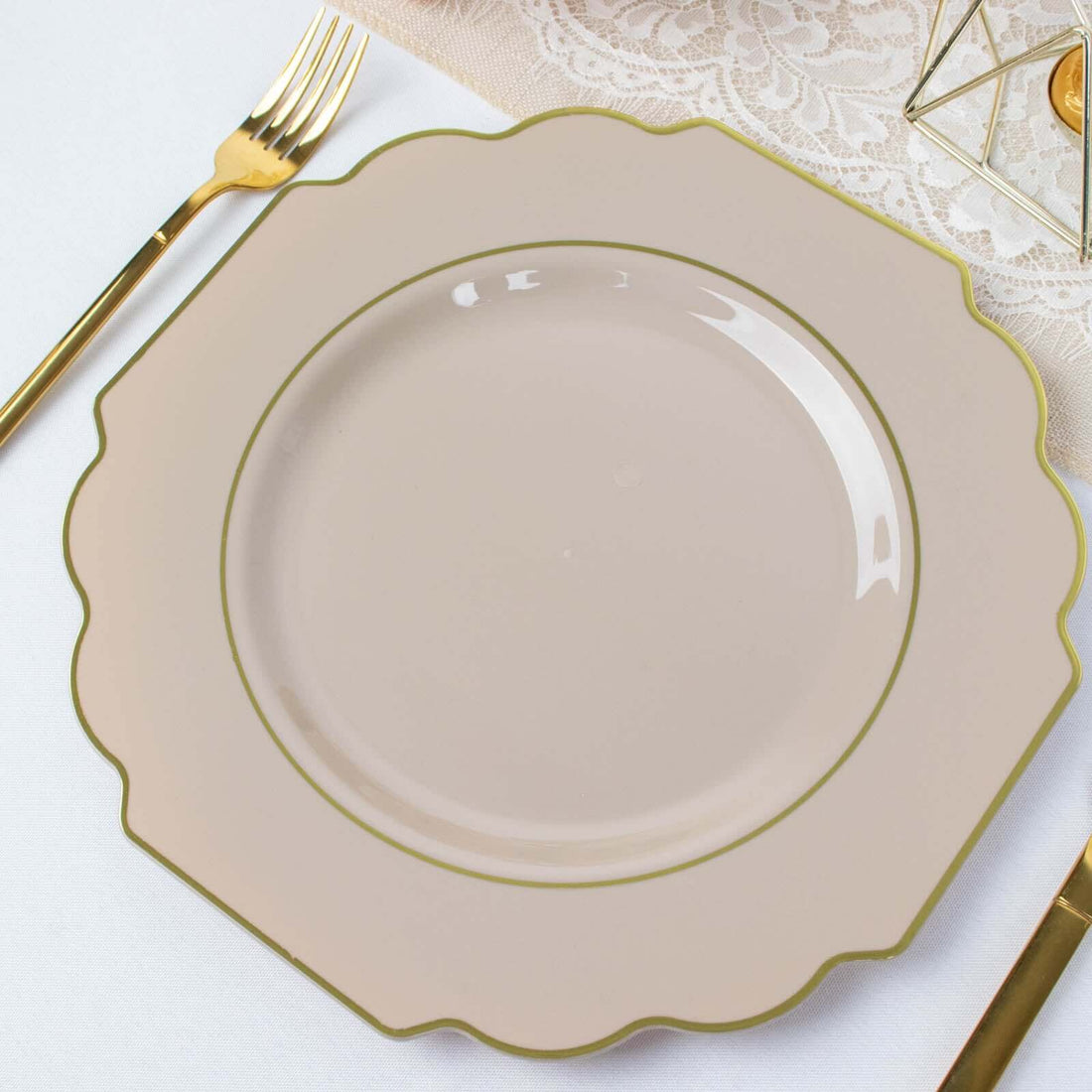 Elegant scalloped dinner plate in soft beige with gold trim.