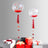 Clear balloons with red confetti and heart accents above gift boxes.