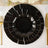Elegant black plates with gold trim arranged on a table setting.