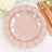 Elegant pink dinner plates layered for a stylish table setting.