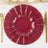 Set of three elegant burgundy plates with gold trim on a white table setting.