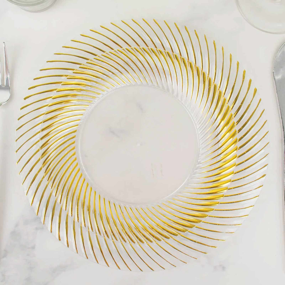 Gold-accented clear decorative plate with spiral design