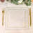 Elegant gold-trimmed plate set on a table with lace and floral decor.