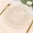 Elegant clear glass plates with gold trim on a soft beige table setting.