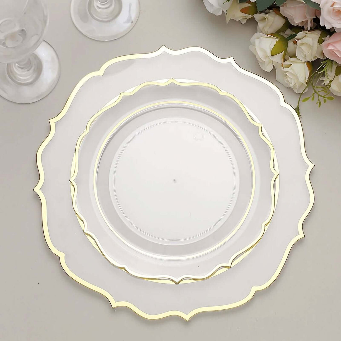Elegant decorative plates with gold trim in a layered arrangement.