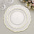 Elegant decorative plates with gold trim in a layered arrangement.