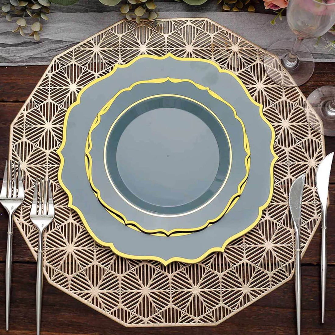 Decorative dining plates in blue and yellow on an elegant placemat.