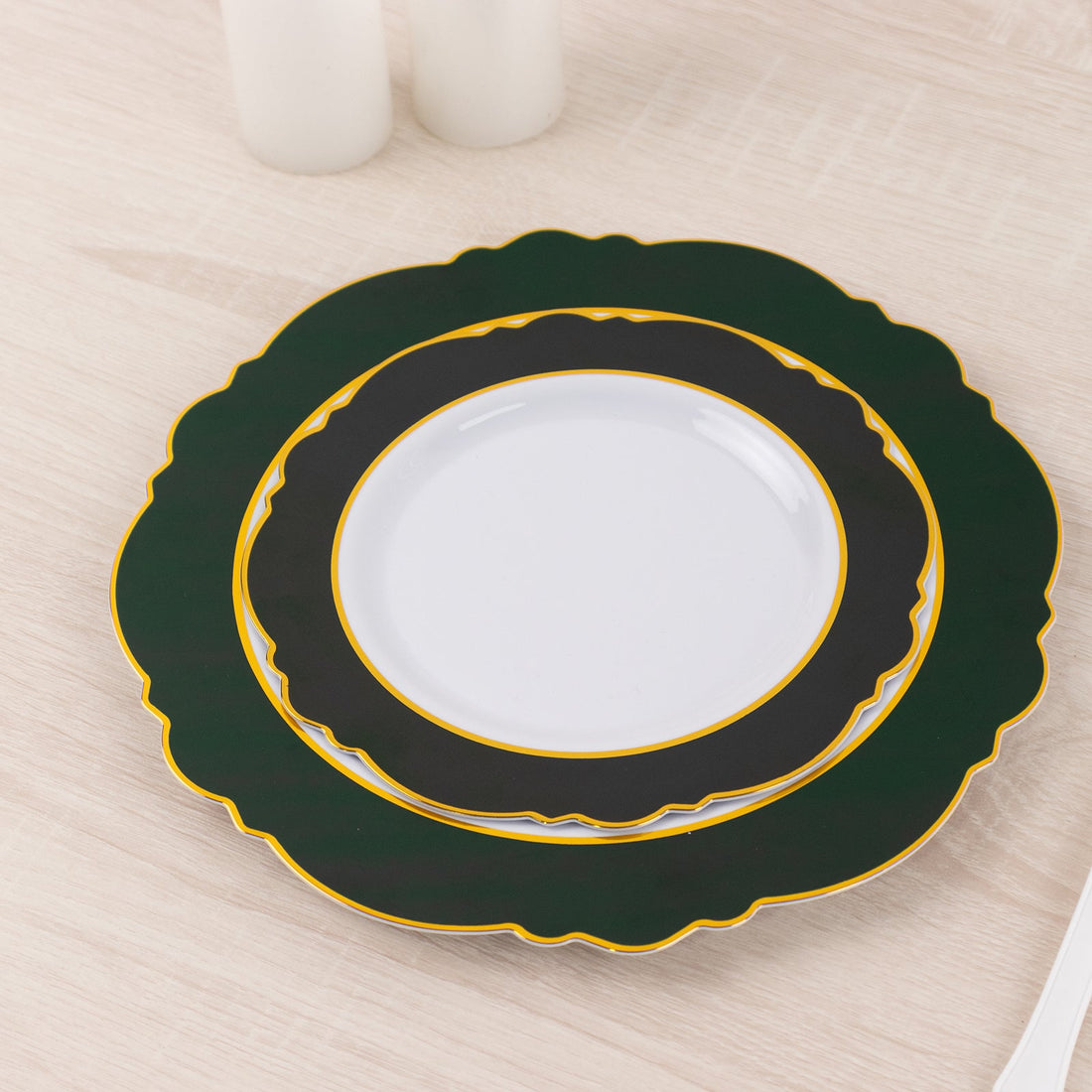 Elegant green and white decorative plates stacked together.