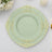 Elegant mint green plate with gold detailing, suitable for formal dining.
