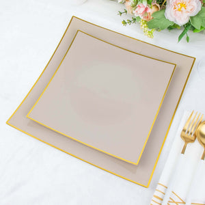 Elegant stacked plates with gold trim on a soft background.