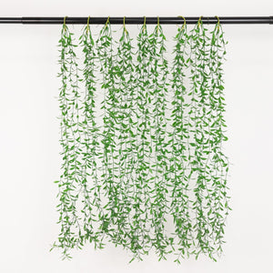 Artificial hanging greenery garland with cascading leaves