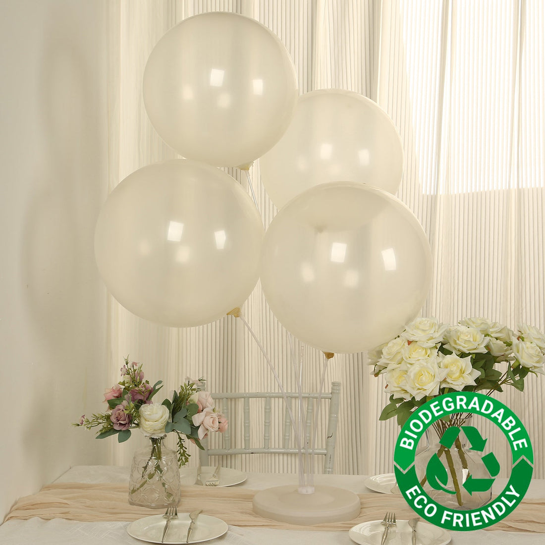 Biodegradable clear balloons with eco-friendly label on a table setting.