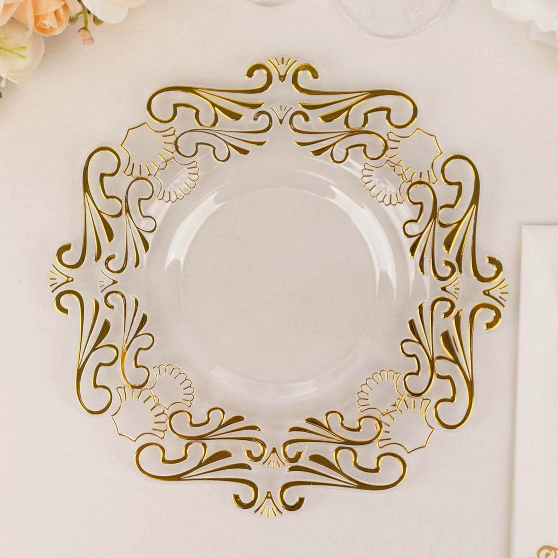 Elegant gold and clear decorative plate with intricate floral design.