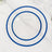 Clear plates with blue rims stacked on a marble surface.