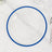 Clear plate with blue rim on marble surface.