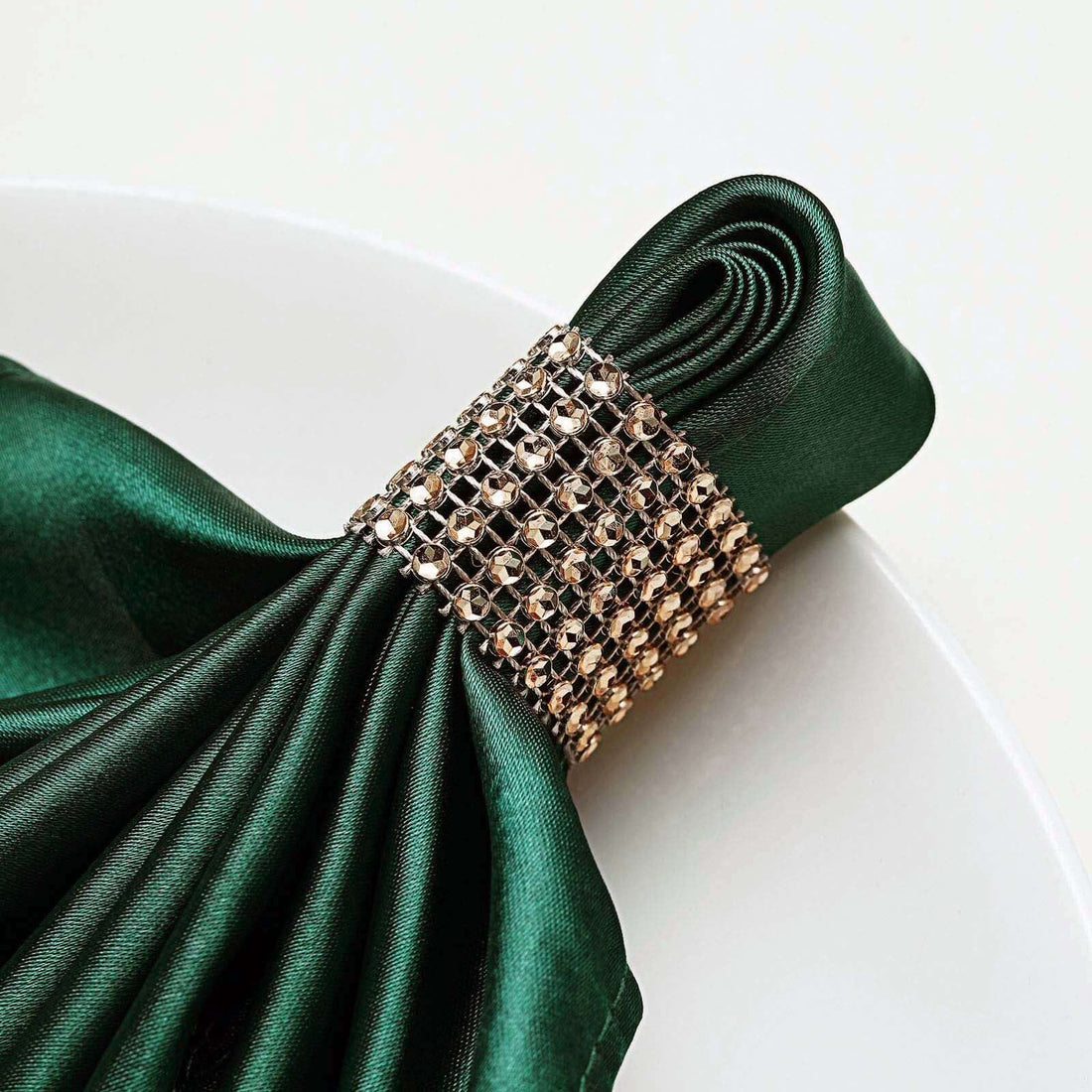 Elegant green satin napkin with jeweled ring holder