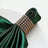 Elegant green satin napkin with jeweled ring holder