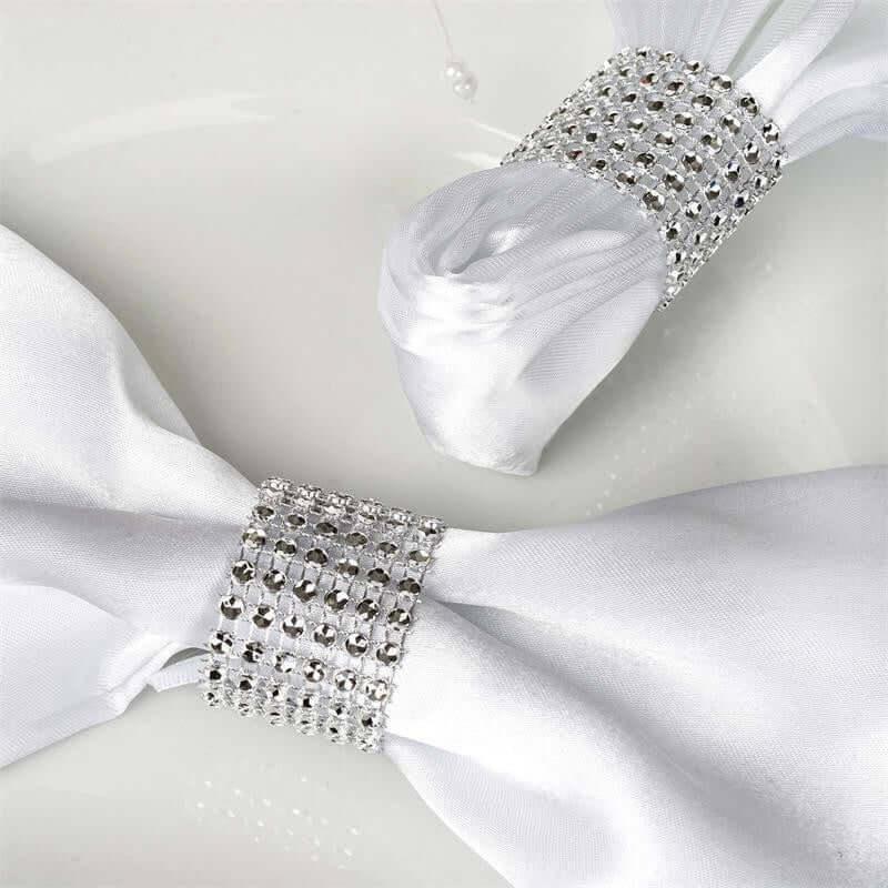 Elegant white napkin rings adorned with sparkling crystals
