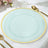 Mint green serving plate with a gold rim on a table setting.