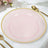Pink plate with gold rim on a table setting